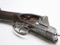 The Sidelock engraving is a tight laser etched pattern of beautiful scroll