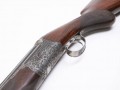 Round action 12 bore over and under with full scroll engraving